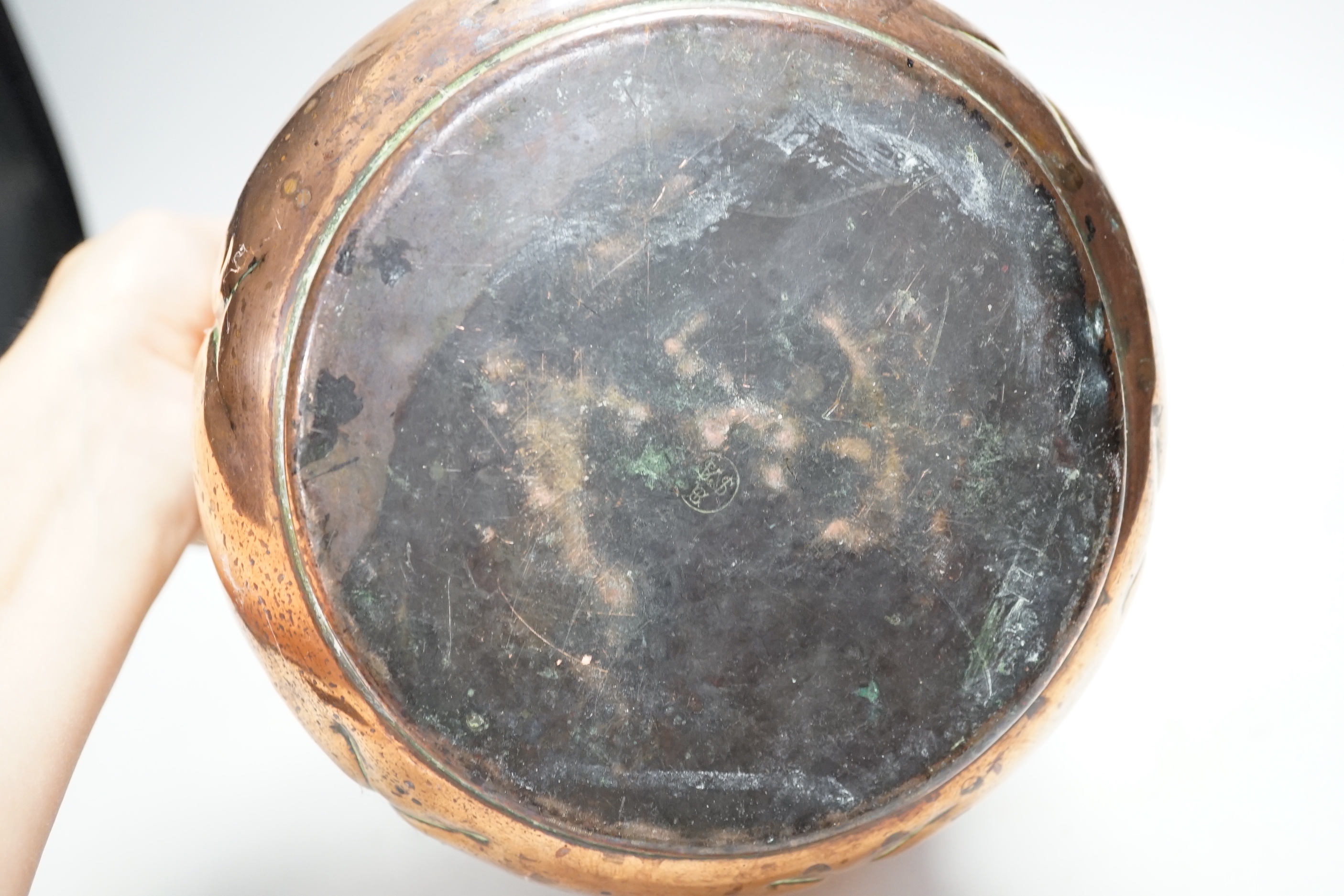 A W.A.S. Benson Arts and Crafts embossed copper jardiniere, impressed mark to the base, 19cm high